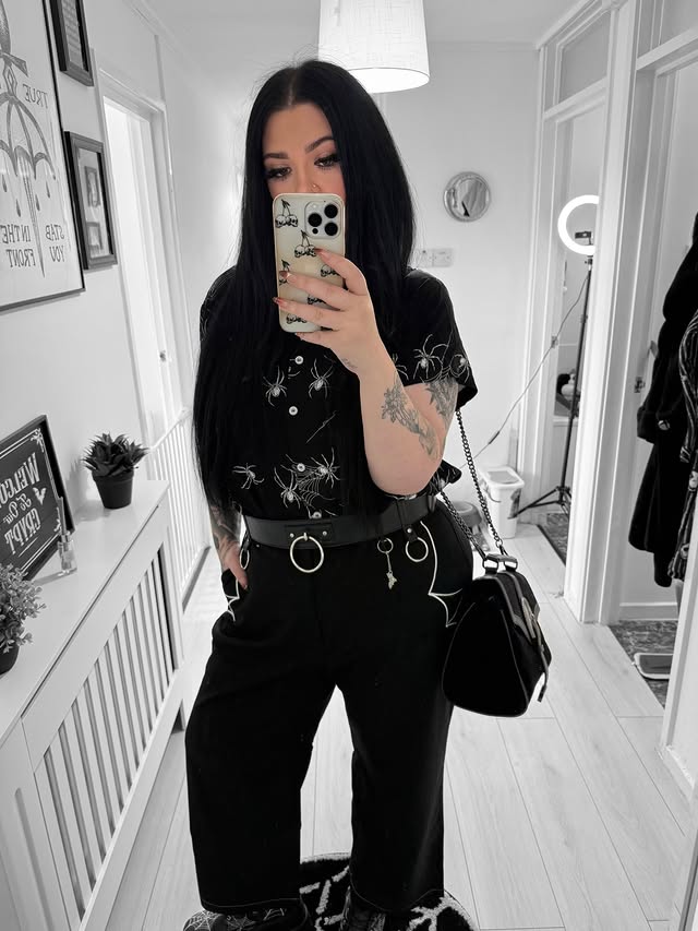 Instagram post by @beautevil.corpse for Hell Bunny. Caption reads: Spidey Fit 🕷️ Fit is @hellbunnyofficial....