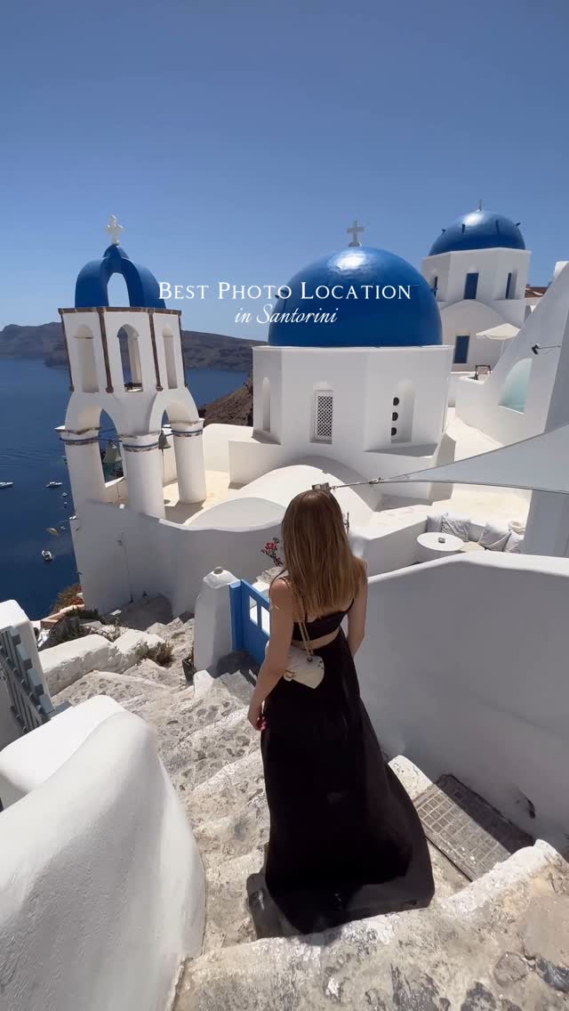 Instagram post by @victoriachmel for Spartoo. Caption reads: This view with the famous blue domes in Santorini....
