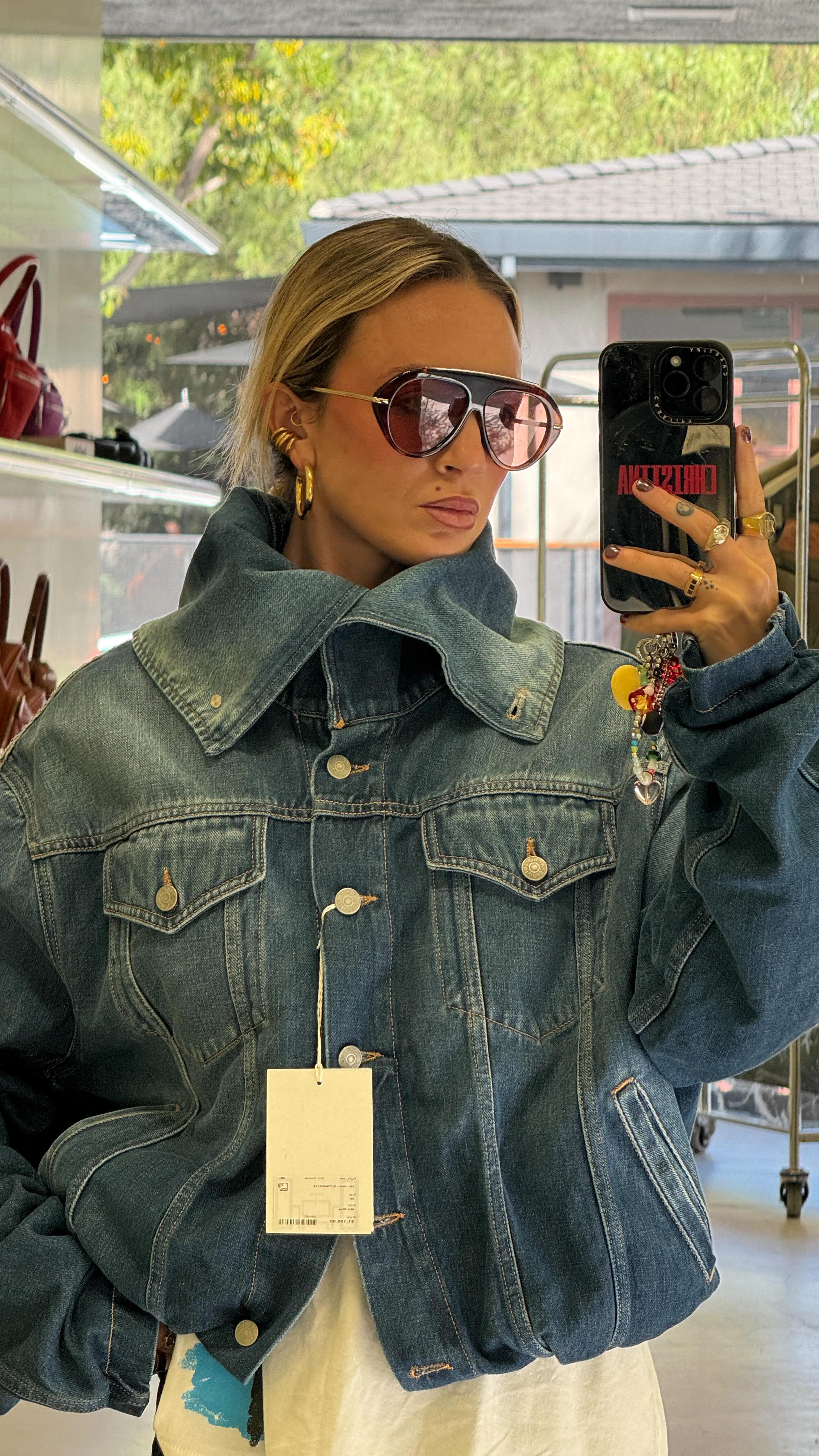 Instagram post by @christinakirkman for Acne Studios. Caption reads: no way I was leaving without her @acnestudios.