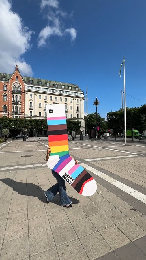 Instagram post by @interpride for Happy Socks. Caption reads: [...] and to carry on Pride off-season!....