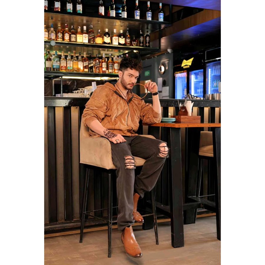 Instagram post by @shaneerbassiofficial for Fugazee. Caption reads: Obsessed with this hoodie from Fugazee! The....