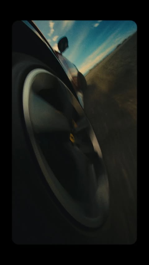 Instagram post by @samkolder for Ferrari. Caption reads: A journey to the end of the world with a Ferrari....