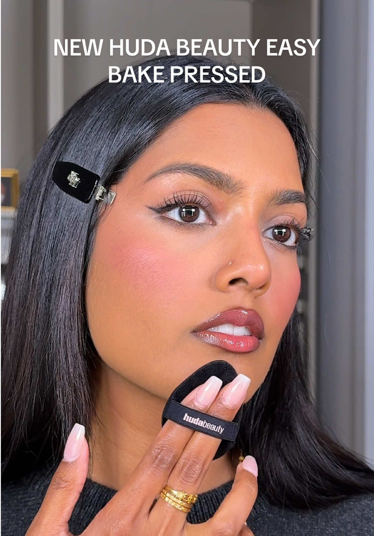 TikTok post by @dhivya.srii for Huda Beauty. Caption reads: NEW easy bake pressed powder by @Huda Beauty!!....