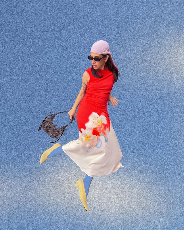 Instagram post by @rebecaoksana for Desigual. Caption reads: anzeige | in the clouds in my @desigual dress 🎀.