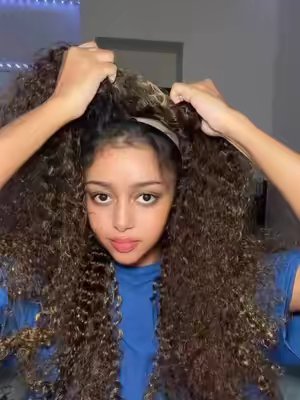 TikTok post by @sambusachick for Cheetah Beauty Hair Shop. Caption reads: [...] The Color, The Curls… YES 👏🏾@Cheetah....