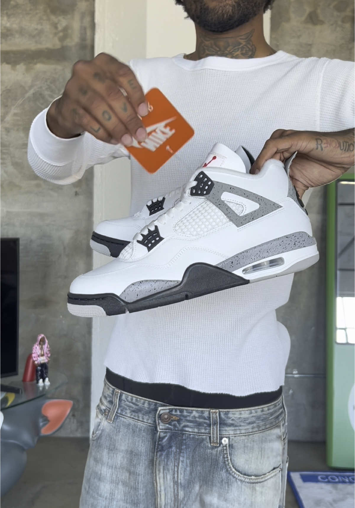 TikTok post by @forestripperton for GOAT. Caption reads: GRWM to style the new Air Jordan 4 “White Cement”....