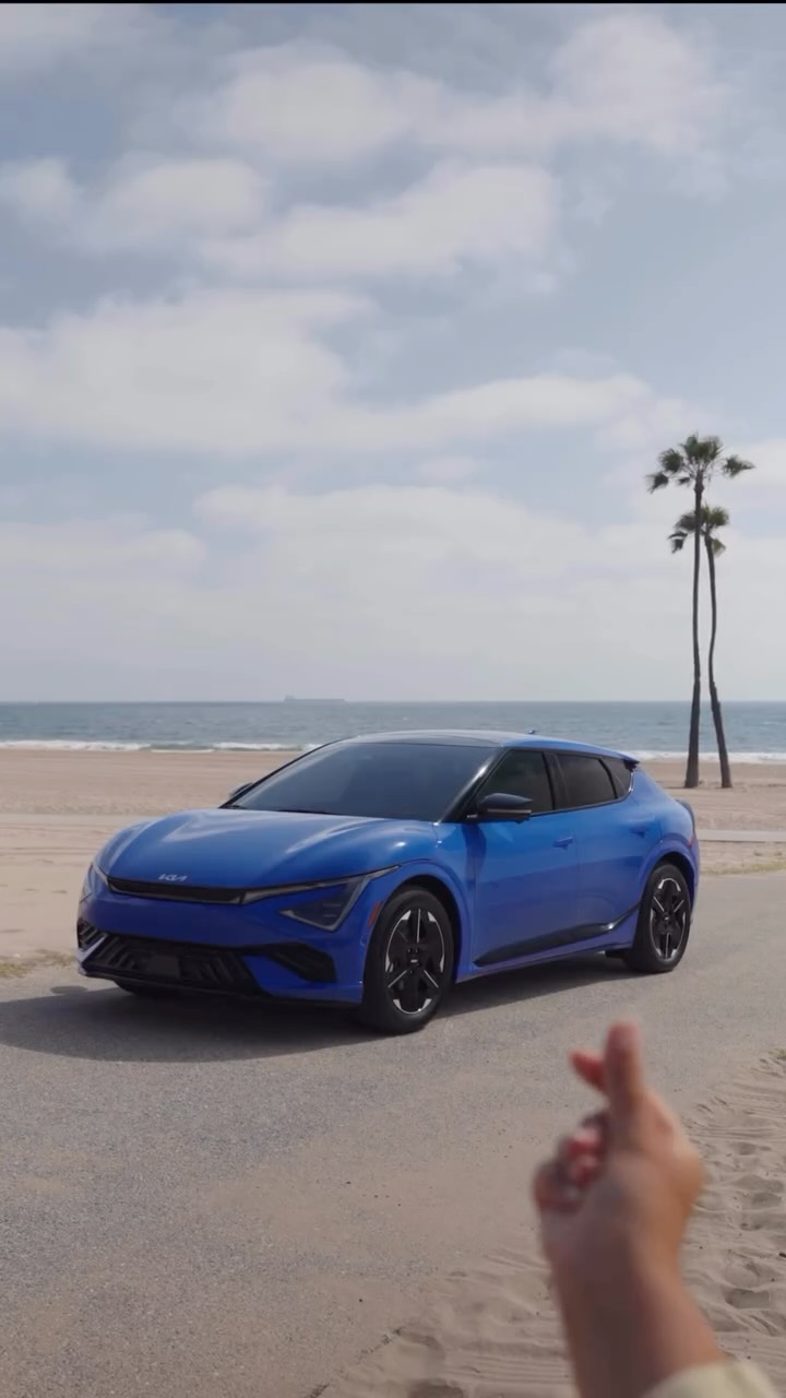 Instagram post by @mackenziedudzik for Kia. Caption reads: Snap. Charged up. New city. 41,000+ fast-charge....