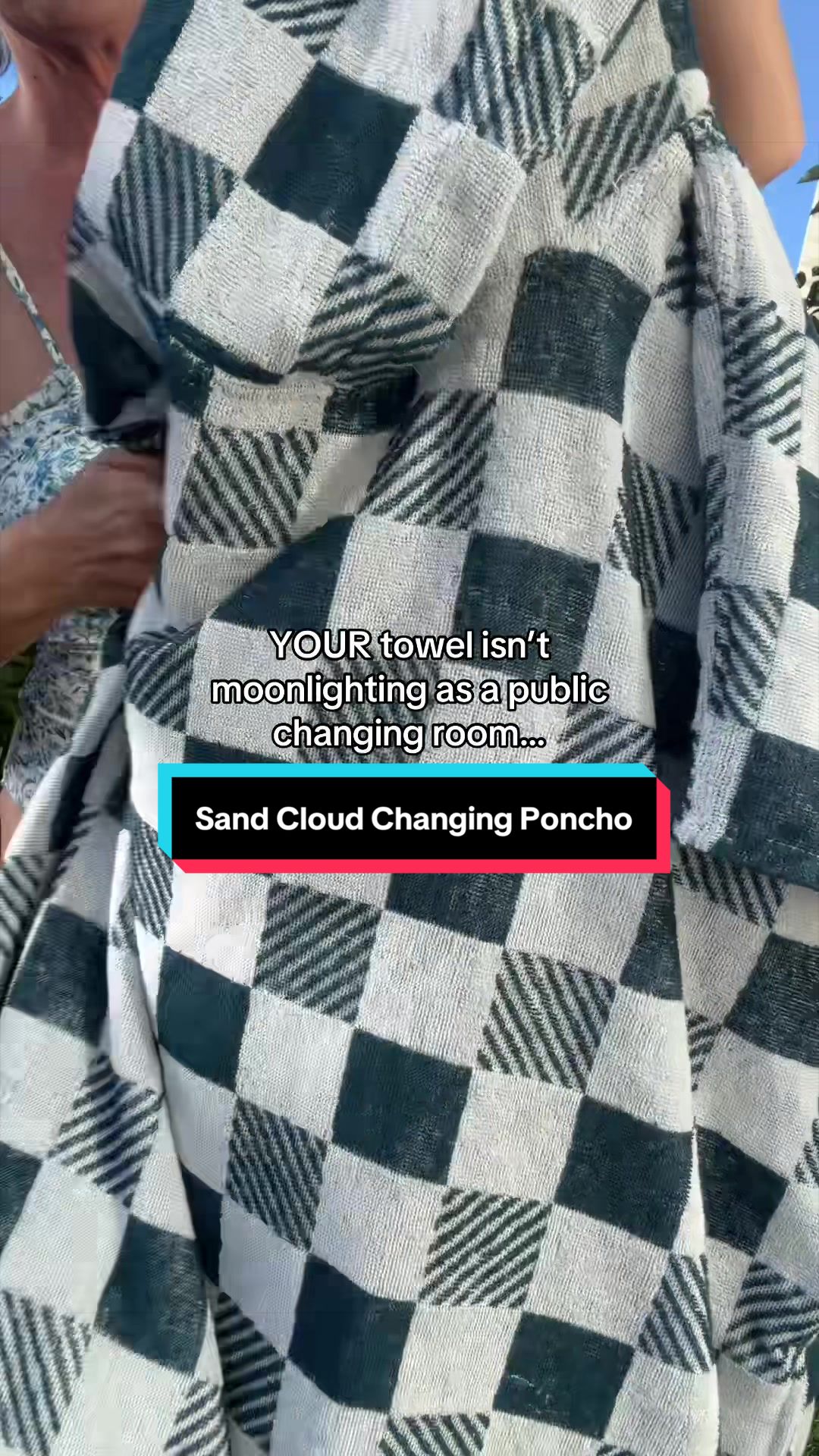 TikTok post by @danie_does_tiktok for Sand Cloud. Caption reads: @Sand Cloud hooded changing poncho is your all in....