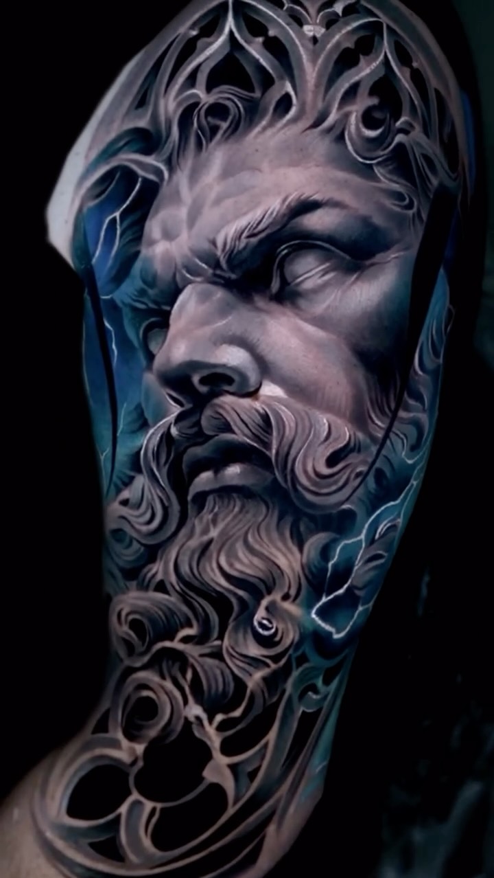 Instagram post by @miguelwom for World Famous Tattoo Ink. Caption reads: •Zeus• greys with color influence , thanks to my....