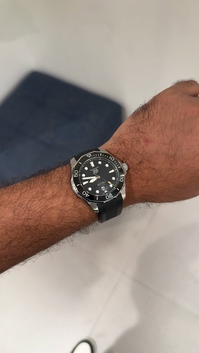 Instagram post by @madpilotx for TAG Heuer. Caption reads: current Favourite @tagheuer Aquaracer Professional....