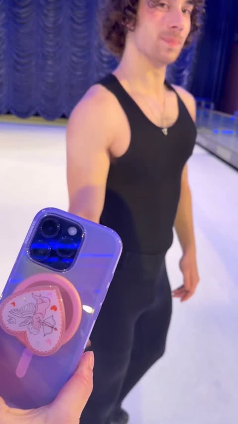 Instagram post by @ryan.dunk for PopSockets. Caption reads: [...] with cupid at my fingertips🥹🏹💖....