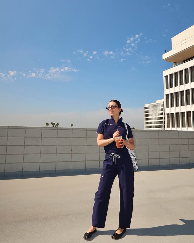 Instagram post by @mona.the.pa for FIGS. Caption reads: [...] girls wear cool scrubs 🙆🏻‍♀️ New @wearfigs....